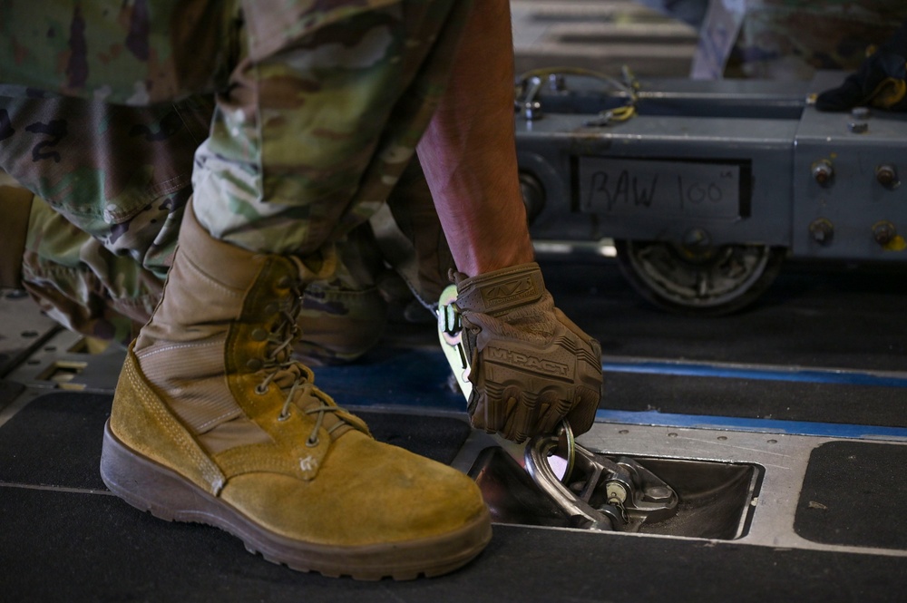 56th RGS load an HH-60W onto a C-17 for a routine deployment