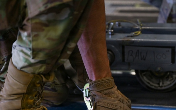 56th RGS load an HH-60W onto a C-17 for a routine deployment