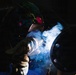 509th CES welds pipe sections for Base Exchange HVAC project
