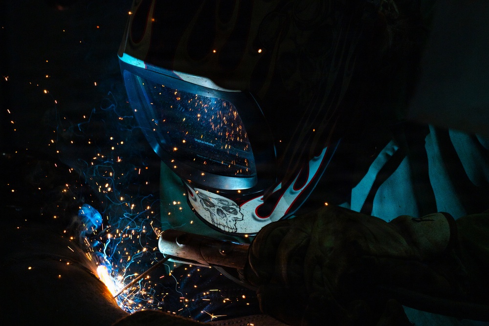 509th CES welds pipe sections for Base Exchange HVAC project