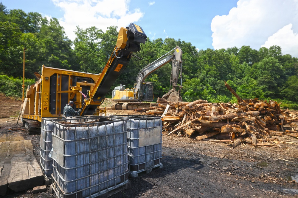 Hurricane Helene debris Is loaded into a carbonizer to produce biochar