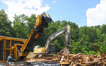 Hurricane Helene debris Is loaded into a carbonizer to produce biochar