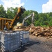 Hurricane Helene debris Is loaded into a carbonizer to produce biochar