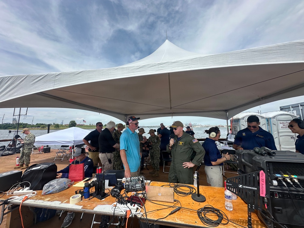 Rear Adm. David Faehnle, Commandant, Naval District Washington, speaks air show announcer