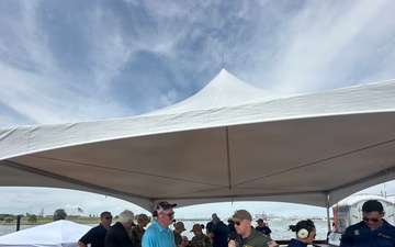 Rear Adm. David Faehnle, Commandant, Naval District Washington, speaks air show announcer