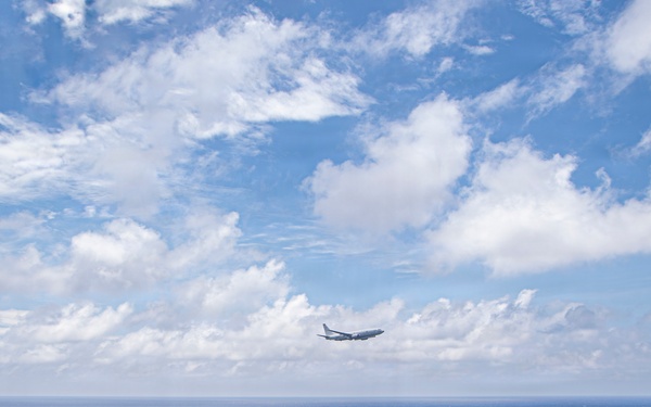 P-8A Poseidon Flies Over USS Nimitz