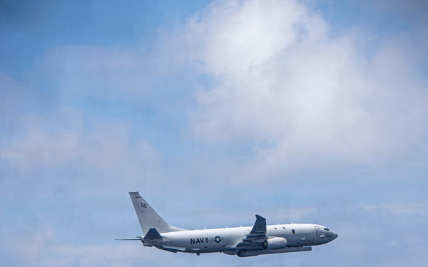 P-8A Poseidon Flies Over USS Nimitz