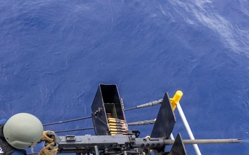 USS Frank Cable conducts gun shoot