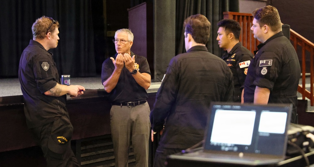 Partner nation service members attend IAMD presentation during RIMPAC 2026