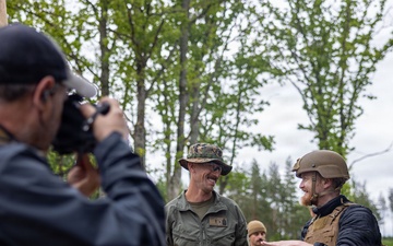 U.S. Marine Corps explosive ordnance disposal technicians engage with international media in Latvia