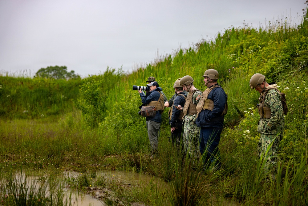 U.S. Marine Corps explosive ordnance disposal technicians engage with international media in Latvia
