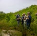 U.S. Marine Corps explosive ordnance disposal technicians engage with international media in Latvia
