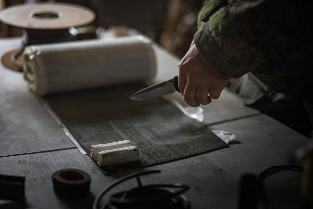 U.S. Marine Corps explosive ordnance disposal technicians engage with international media in Latvia