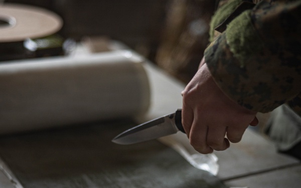 U.S. Marine Corps explosive ordnance disposal technicians engage with international media in Latvia
