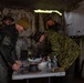U.S. Marine Corps explosive ordnance disposal technicians engage with international media in Latvia