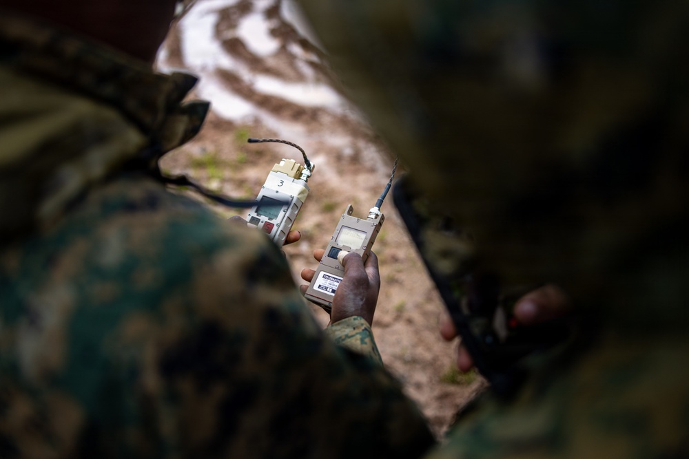 U.S. Marine Corps explosive ordnance disposal technicians engage with international media in Latvia