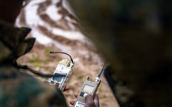 U.S. Marine Corps explosive ordnance disposal technicians engage with international media in Latvia