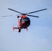USCG MH-65 Dolphin flies over USCGC Eagle