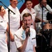 U.S. Navy personnel perform during a live musical concert
