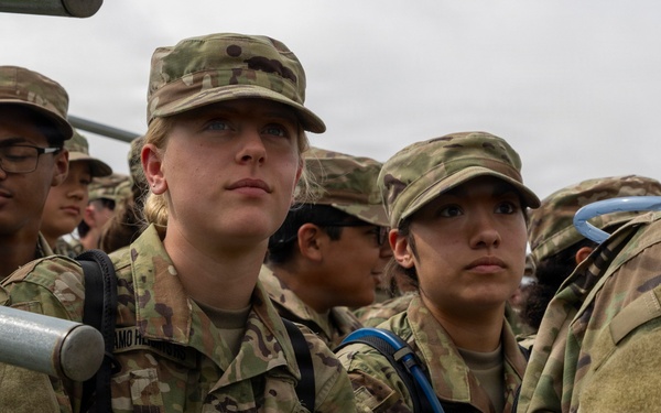 Reserve Officers' Training Corps (JROTC) watch 1st Cavalry Division Horse Cavalry Detachment demonstration