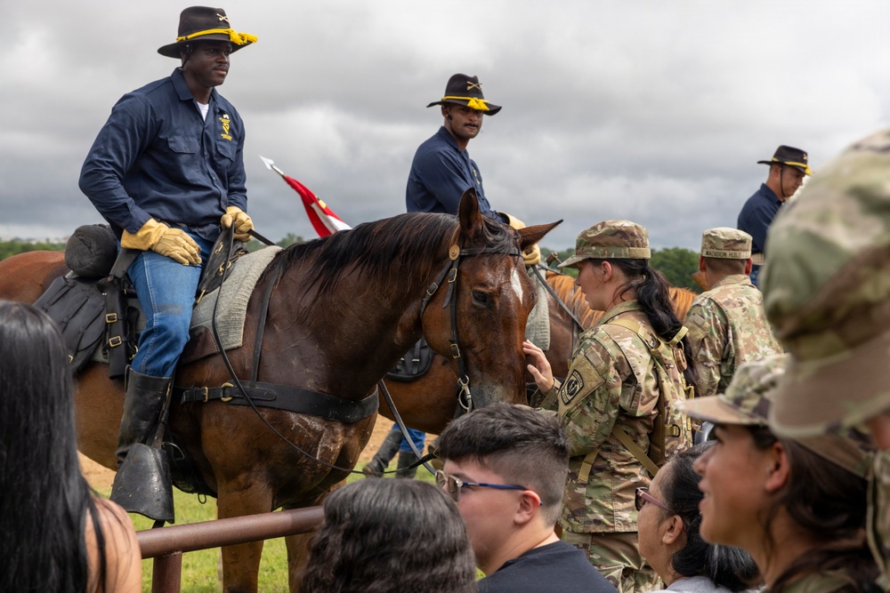 Reserve Officers' Training Corps (JROTC) watch 1st Cavalry Division Horse Cavalry Detachment demonstration