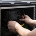 Slingshot: VMFA-214 sets up PRC-160(V) radio
