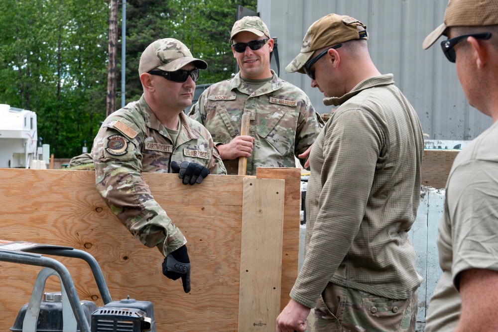169th CES Airmen construct pole barn during Alaska DFT