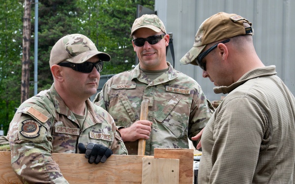 169th CES Airmen construct pole barn during Alaska DFT