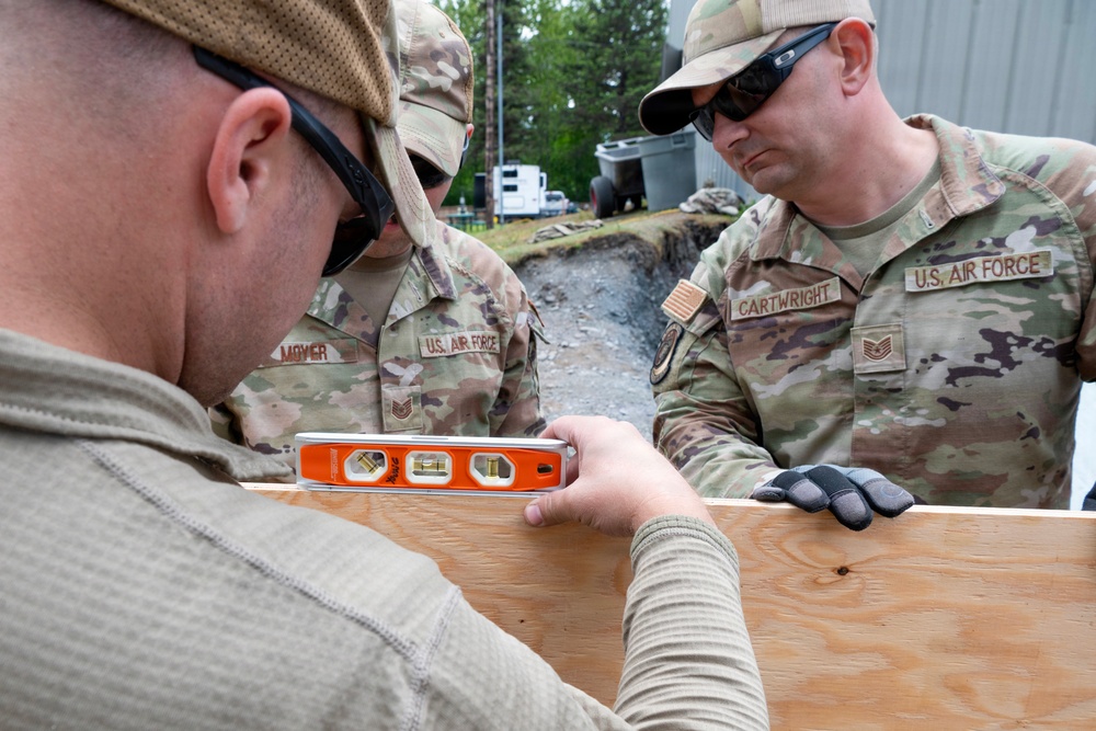 169th CES Airmen construct pole barn during Alaska DFT