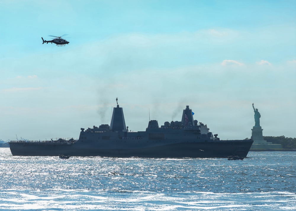 USS Arlington (LPD 24) sails past Statue of Liberty