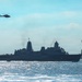 USS Arlington (LPD 24) sails past Statue of Liberty