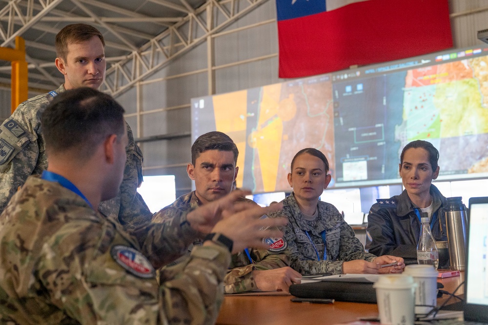 Exercise Resolute Sentinel - Salitre 2026 participants work together in the Combined Air Operations Center
