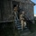 Deep Strike 10th Special Forces Group Two armed military personnel in camouflage uniforms are exiting a weathered wooden training structure via metal stairs. Both soldiers are equipped with weapons and helmets featuring blue training markers, indicating this is a military training exercise. The scene appears to take place at dusk or in low-light conditions at a military training facility.