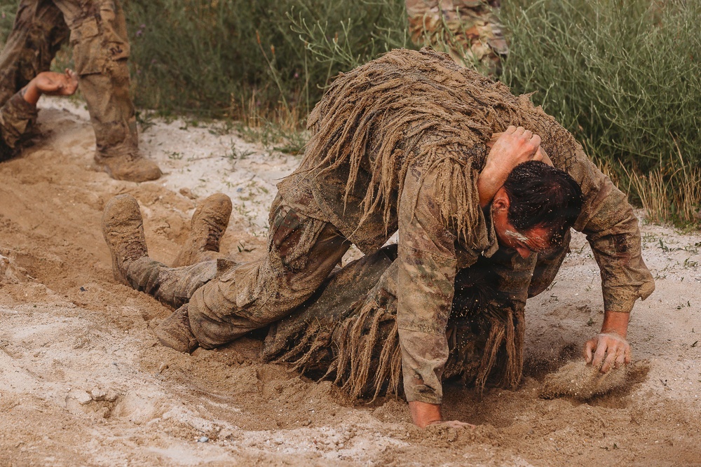 1-112th Infantry Recon squads conduct ‘ghillie wash’ training event