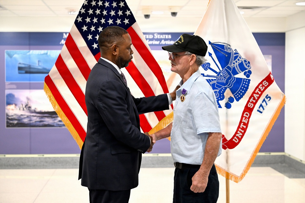 Army Reserve Ambassador presents Purple Heart to Vietnam War veteran
