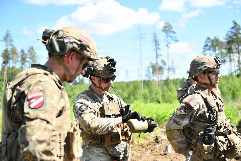 107th Engineer Battalion Soldiers of the Michigan Army National Guard and Latvian Zemessardzes build defensive training areas with NATO partners.