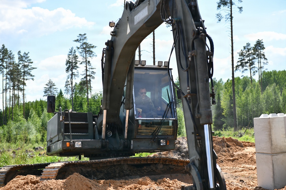 107th Engineer Battalion Soldiers of the Michigan Army National Guard and Latvian Zemessardzes build defensive training areas with NATO partners.
