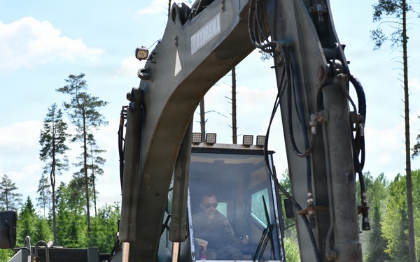 107th Engineer Battalion Soldiers of the Michigan Army National Guard and Latvian Zemessardzes build defensive training areas with NATO partners.