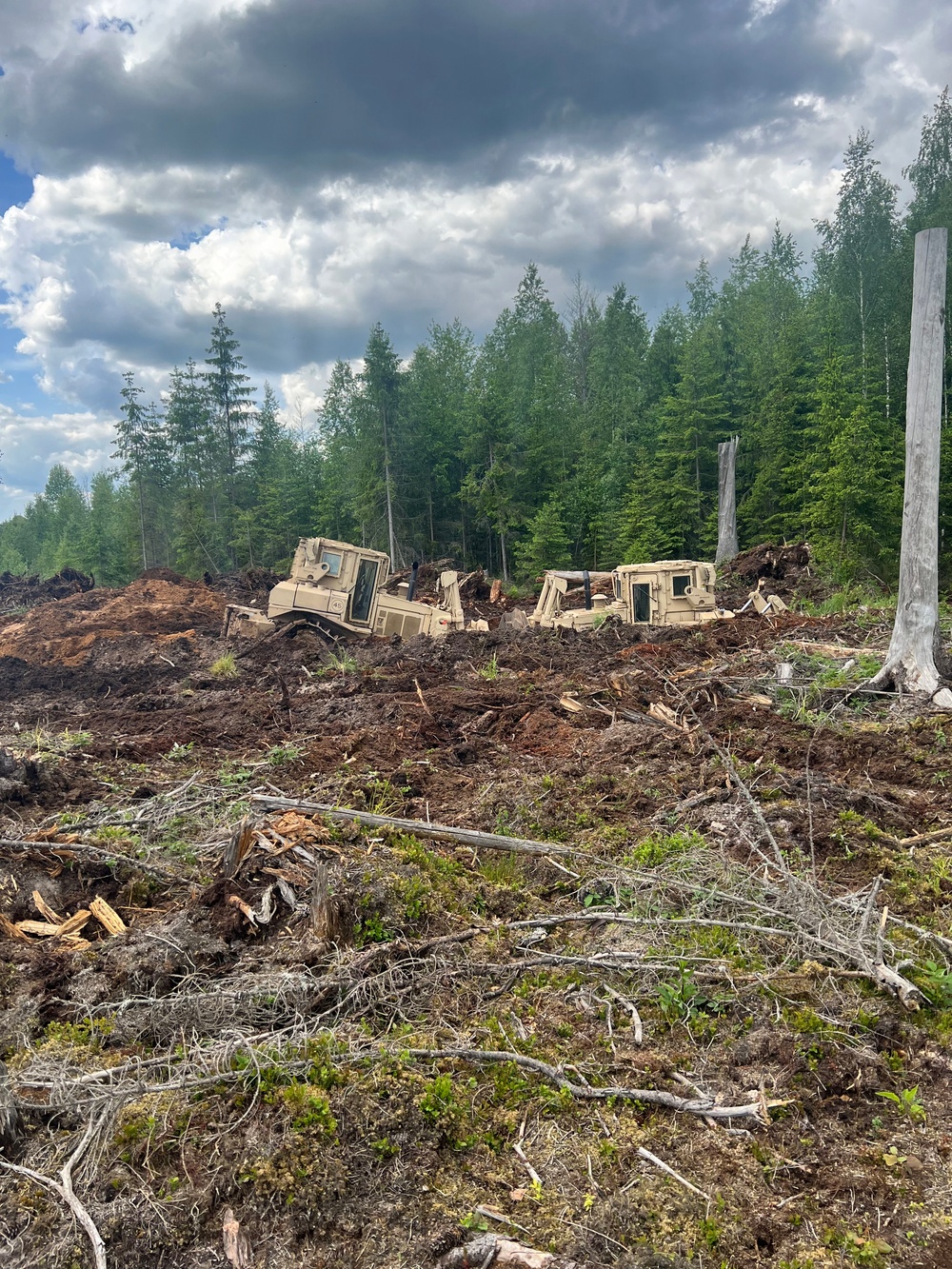 107th Engineer Battalion Soldiers of the Michigan Army National Guard and Latvian Zemessardzes build defensive training areas with NATO partners.