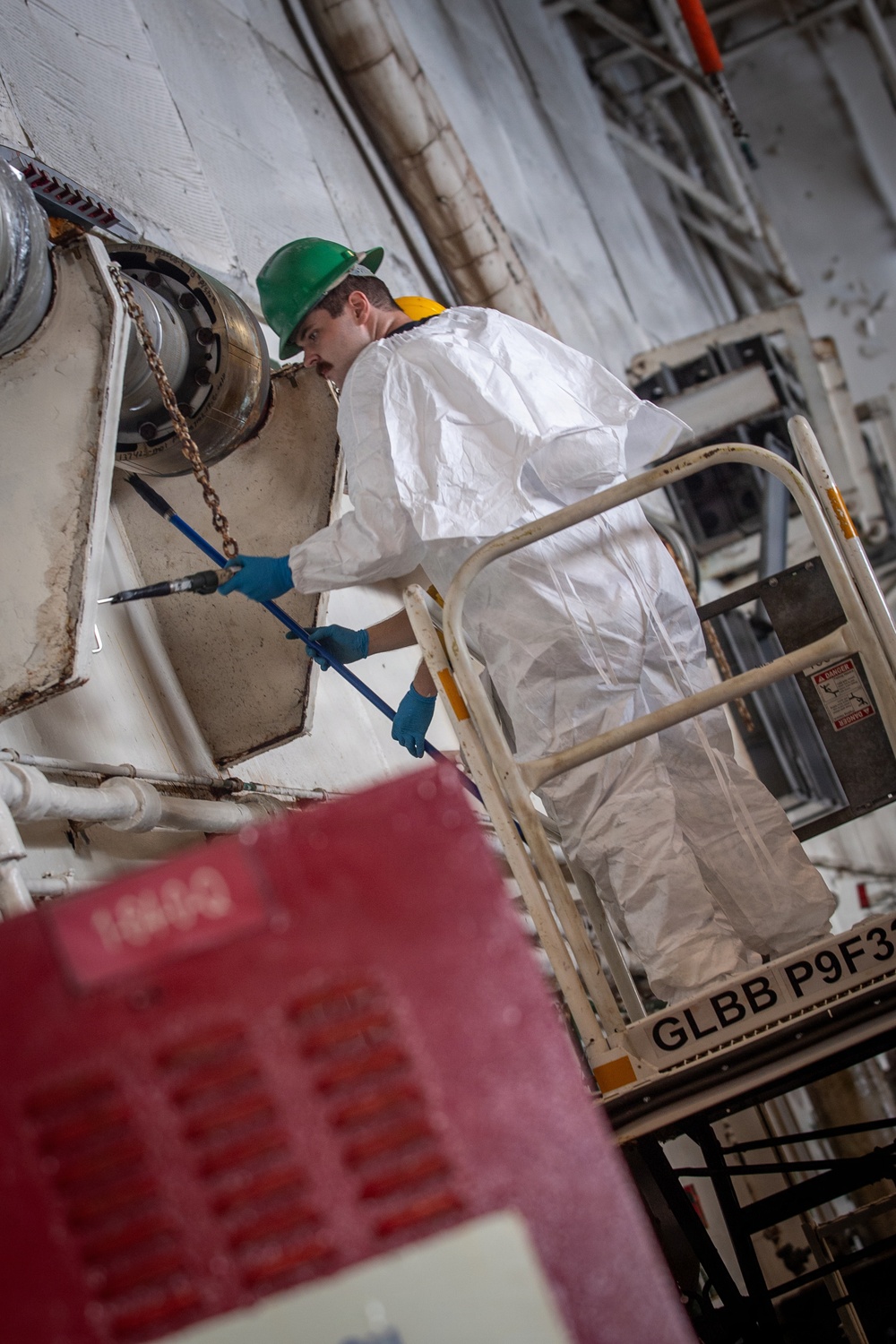 USS Nimitz Sailors Paint the Hangar bay