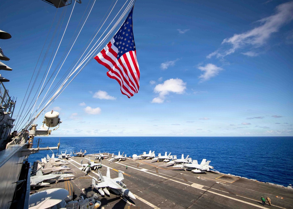 Battle Ensign Raised on USS George Washington Mast
