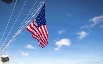 Battle Ensign Raised on USS George Washington Mast