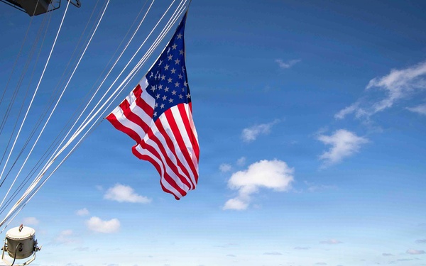 Battle Ensign Raised on USS George Washington Mast