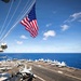 Battle Ensign Raised on USS George Washington Mast