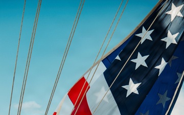 Battle Ensign Raised on USS George Washington Mast
