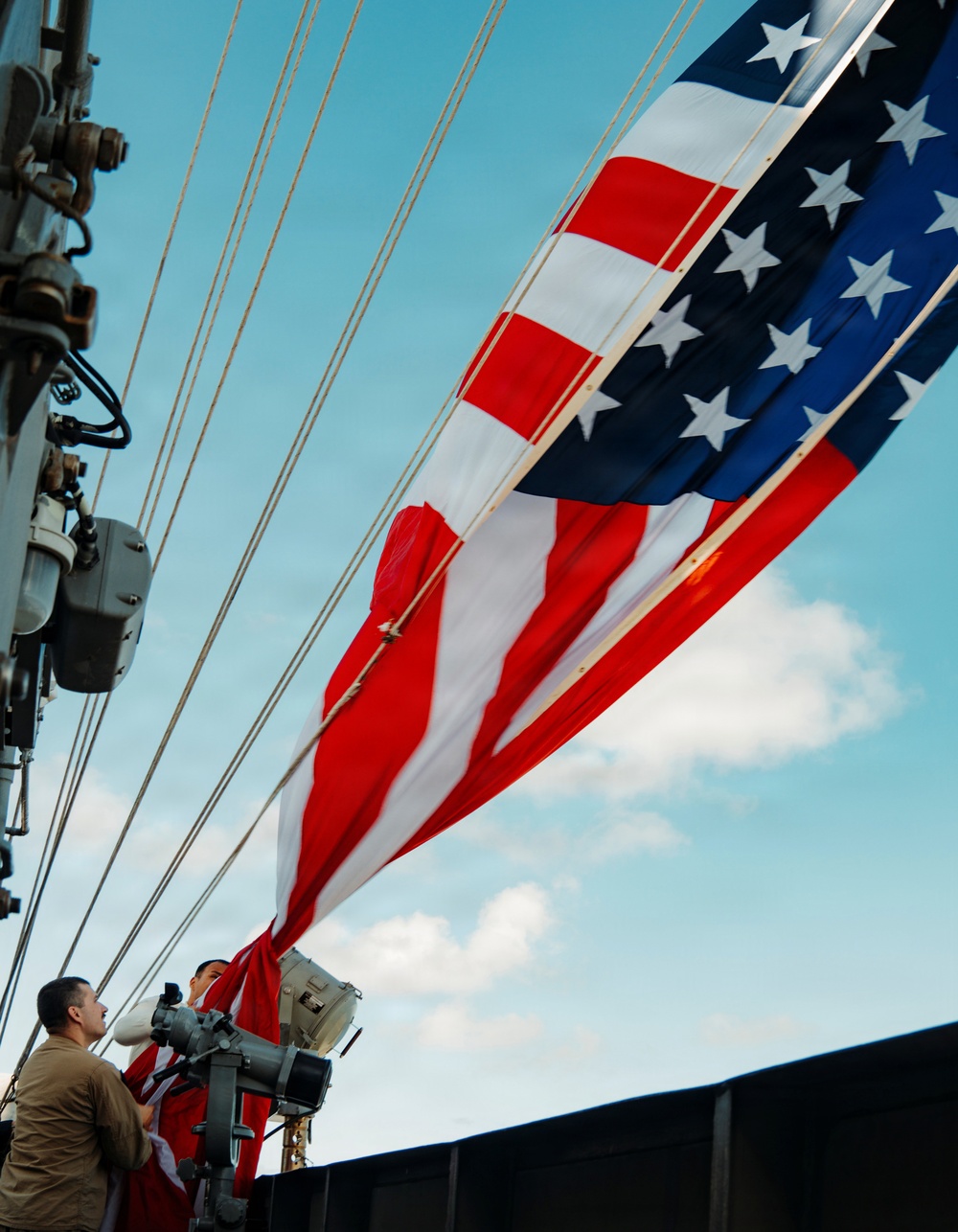 Battle Ensign Raised on USS George Washington Mast