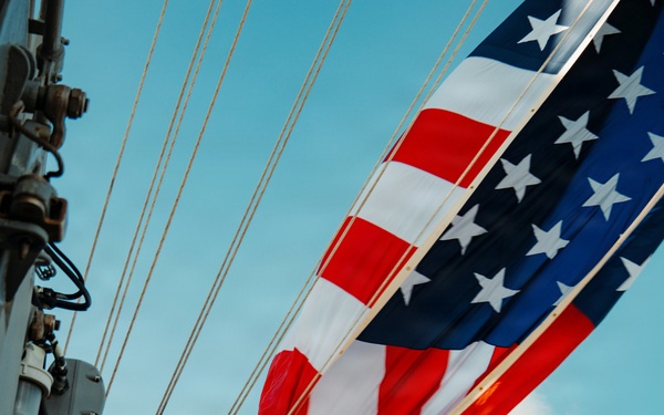 Battle Ensign Raised on USS George Washington Mast