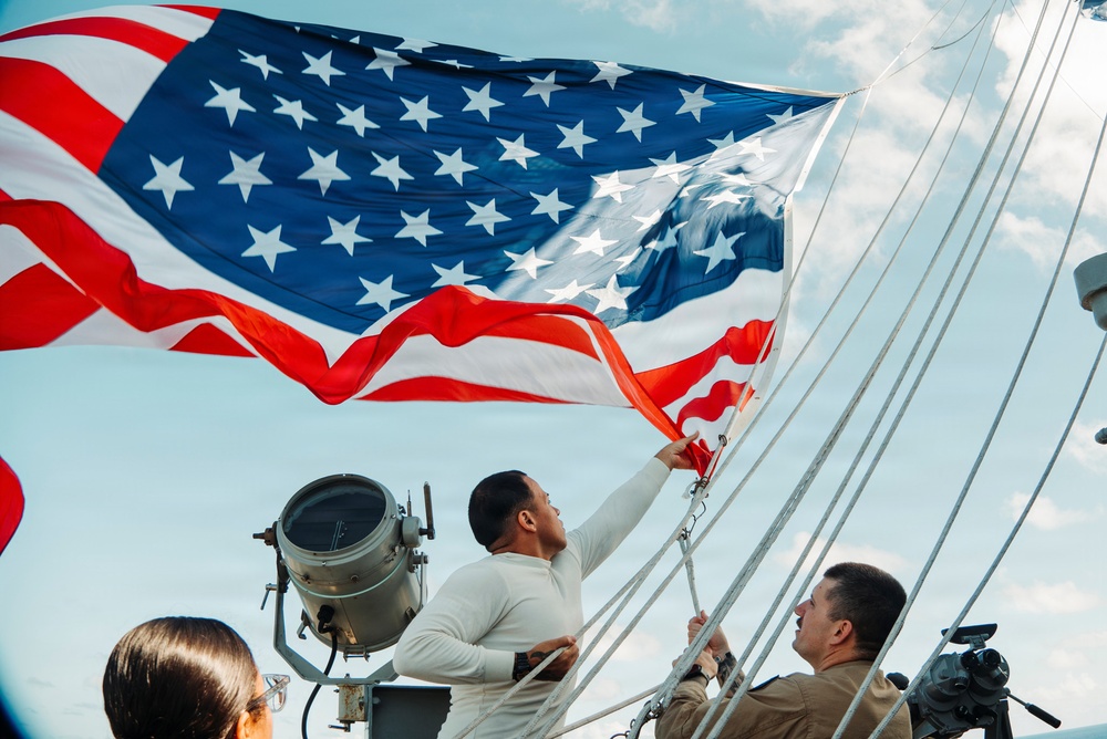 Battle Ensign Raised on USS George Washington Mast