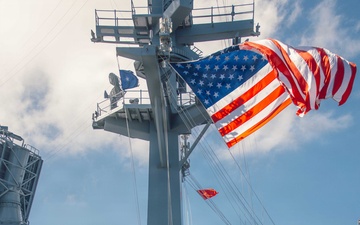 Battle Ensign Raised on USS George Washington Mast