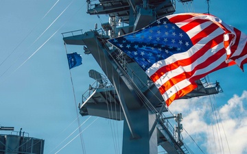 Battle Ensign Raised on USS George Washington Mast